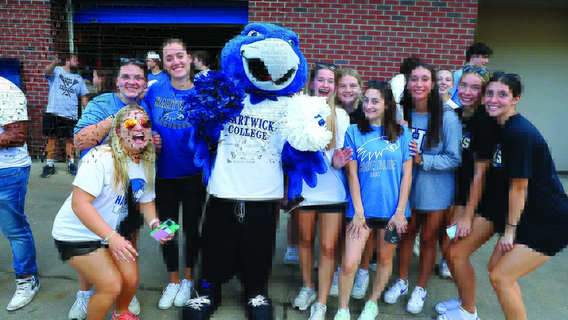 A spirited group of students gathered around Swoop, capturing a moment of Hawk pride and camaraderie.