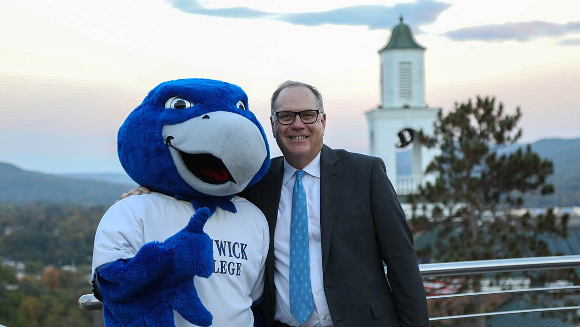 Hartwick College President Jim Mullen with Swoop, Yager Hall Bell Tower and valley view