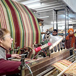 Hartwick art students learning about weaving at Thistle Hill Weavers in Cherry Valley, New York