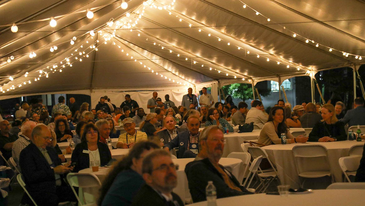Alumni Association Awards Ceremony Crowd under tent during 2024 True Blue Weekend Ceremony
