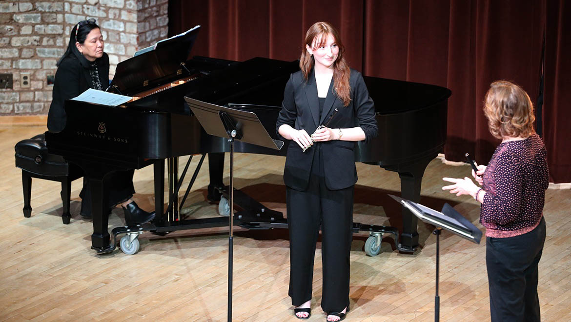 Hartwick College Flute Day, student on stage in Anderson Center with Alison Brown Sincoff, a professor at Ohio University