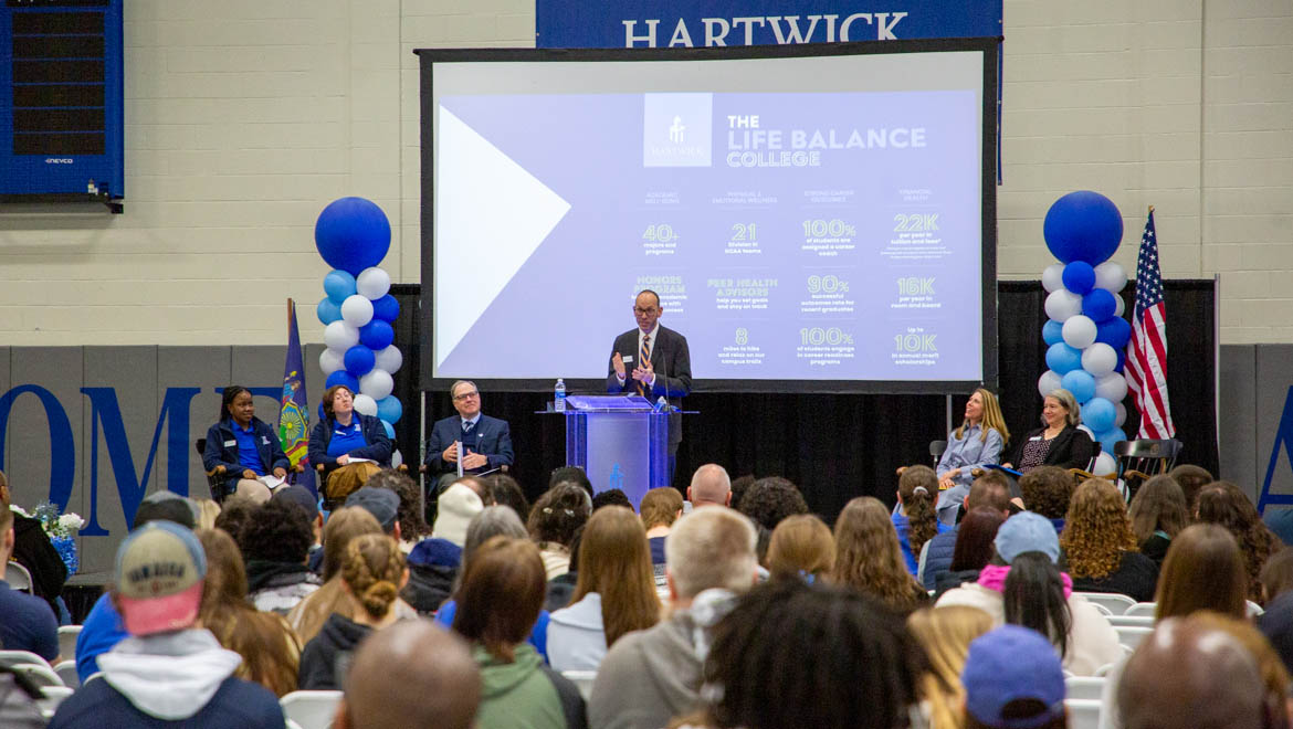 Bryan Gross, vice president for enrollment management and athletics speaks to Hartwick College accepted students and families during Accepted Students' Day in Lambros Arena