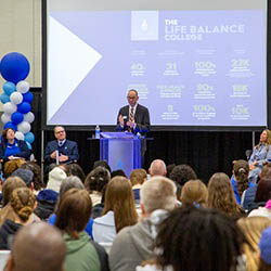 Bryan Gross, vice president for enrollment management and athletics speaks to Hartwick College accepted students and families during Accepted Students' Day in Lambros Arena
