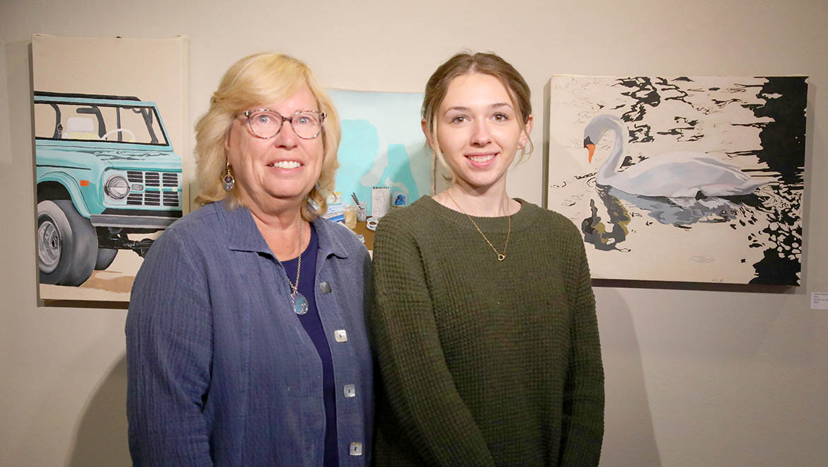 Alison Halstead '26 with painting of swan Nina and Laurel Bongiorno, vice president for academic affairs and provost