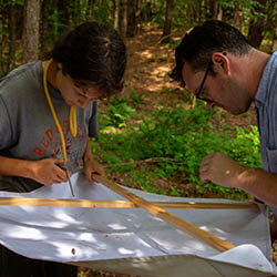 Student and professor with spider sample