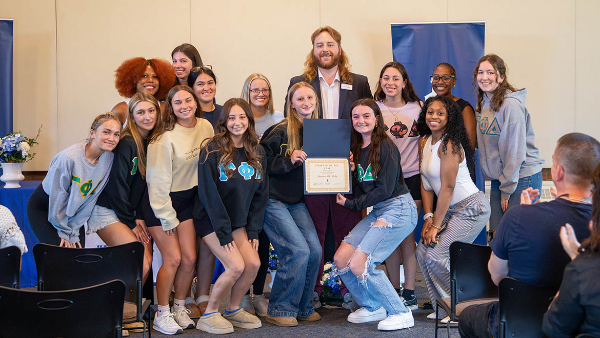 Chapter of the Year – Gamma Phi Delta sisters with Tim Raimy '17