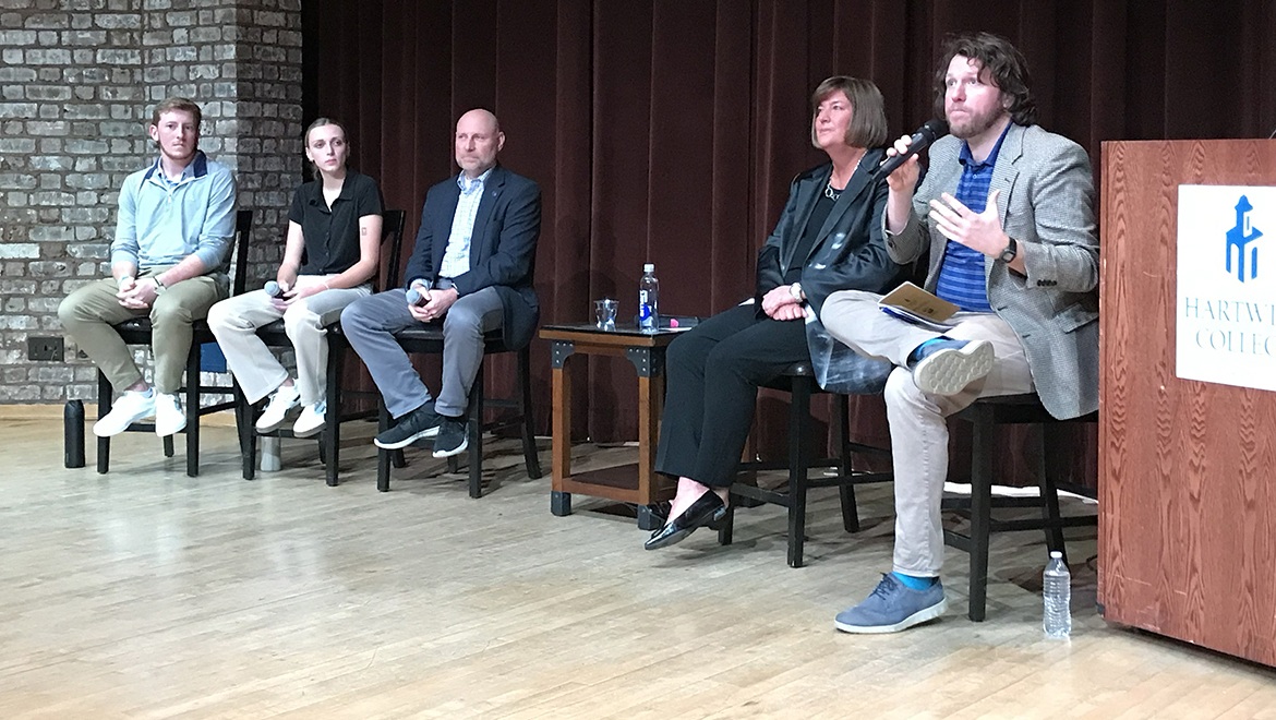 Ryan Ceresola speaking with Amber Steele with panel during discussion