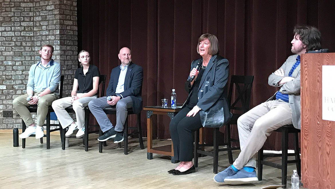 Amber Steele speaking with panel during discussion