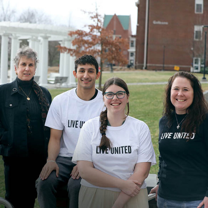 From left, Professor Susan Navarette, Mahdi Behniaye ’26 and Victoria Nash ’25 collaborated with United Way of Mid-Rural New York Executive Director Elizabeth Monaco.