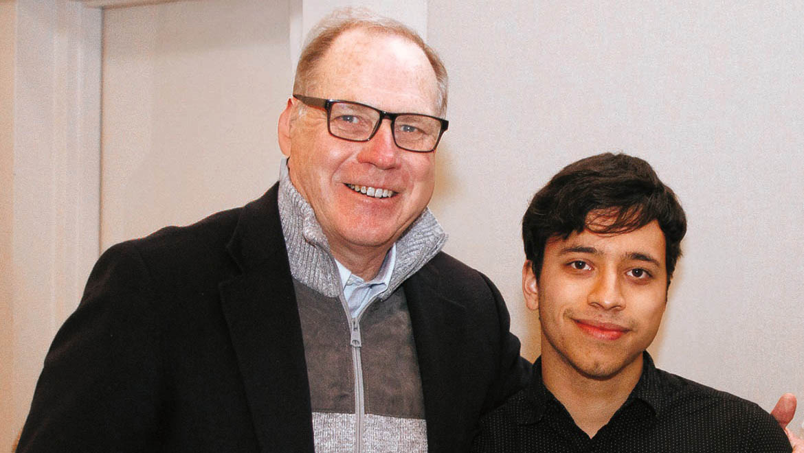 President Mullen congratulates Connor Yarborough on being a member of the inaugural EmpowerU class.