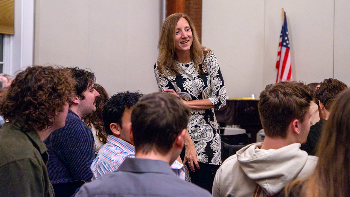 Professsor of Political Science talking with students during Moot Court Competition