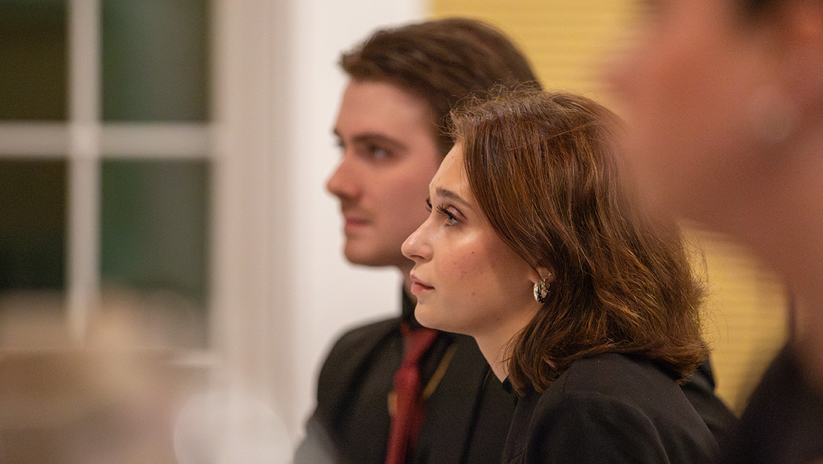 James Dema ’25 and Madeline Rodegher ’28 prepare to compete before a panel of alumni judges during Moot Court