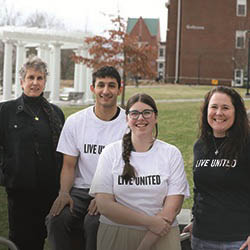From left, Professor Susan Navarette, Mahdi Behniaye ’26 and Victoria Nash ’25 collaborated with United Way of Mid-Rural New York Executive Director Elizabeth Monaco.