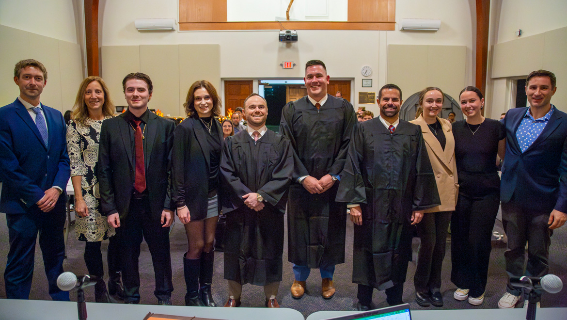 Alumni, students and faculty members celebrate the conclusion of Hartwick’s inaugural Moot Court Competition.