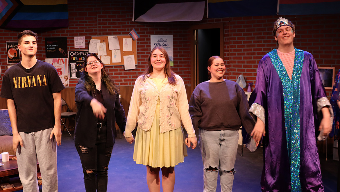 Jas Stuchel ’25 with other actors in performance of Snap