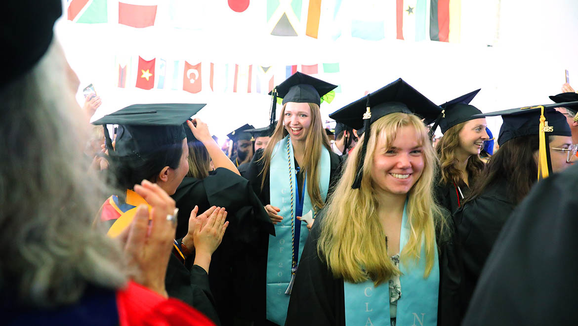 Hartwick College graduates inside Commencement ceremony tent