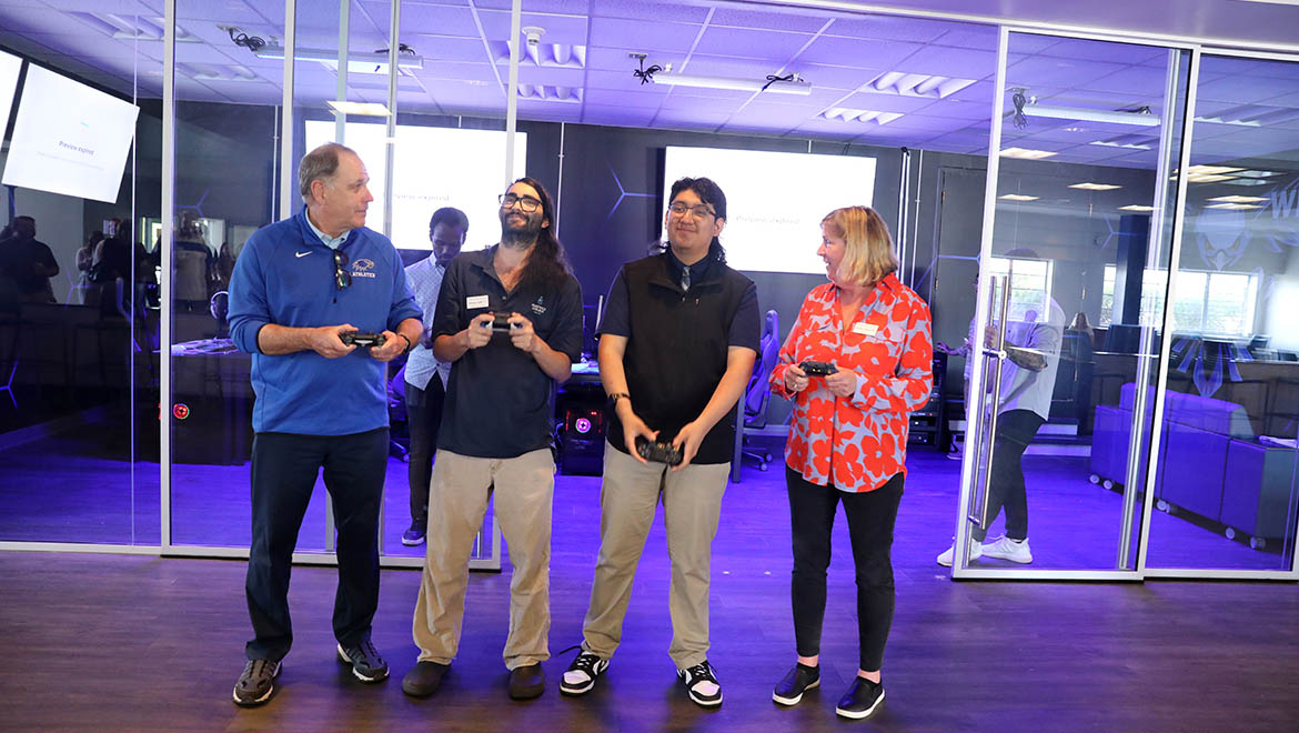 President Mullen, Board of Trustees Chair Kathy Fallon, Media Services Specialist Diman Salil, James Mendez ’26 Esports Club President at the Opening of the Esports Center opening