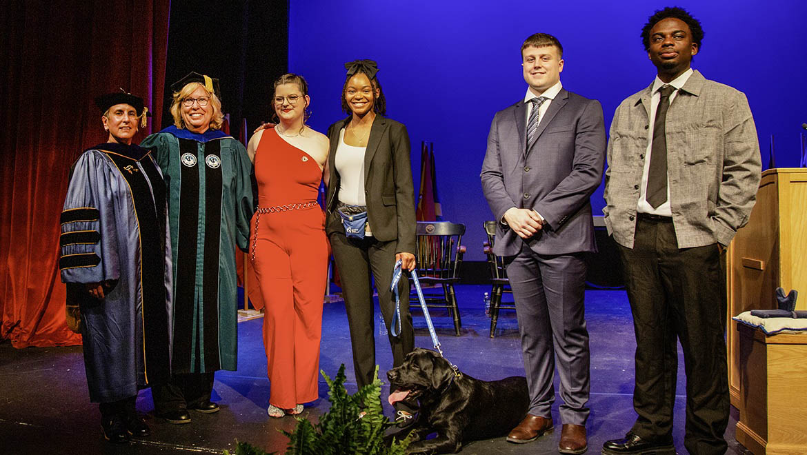 Kellogg Finalists Jae Stuchel '25, Kelechi Springer '25, Roselyn DuMerville '25, with Henry, Guiding Eyes dog with Michael Demarais '24, Professor Navarette and VP for Academic Affairs and Provost Bongiorno