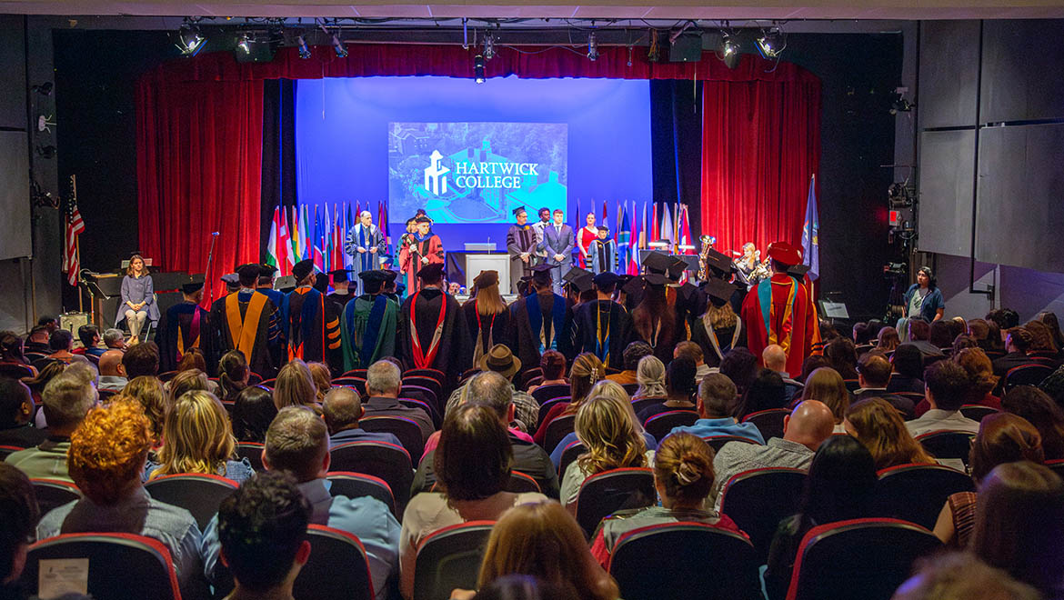 Platform party on stage and audience during Honors Convocation