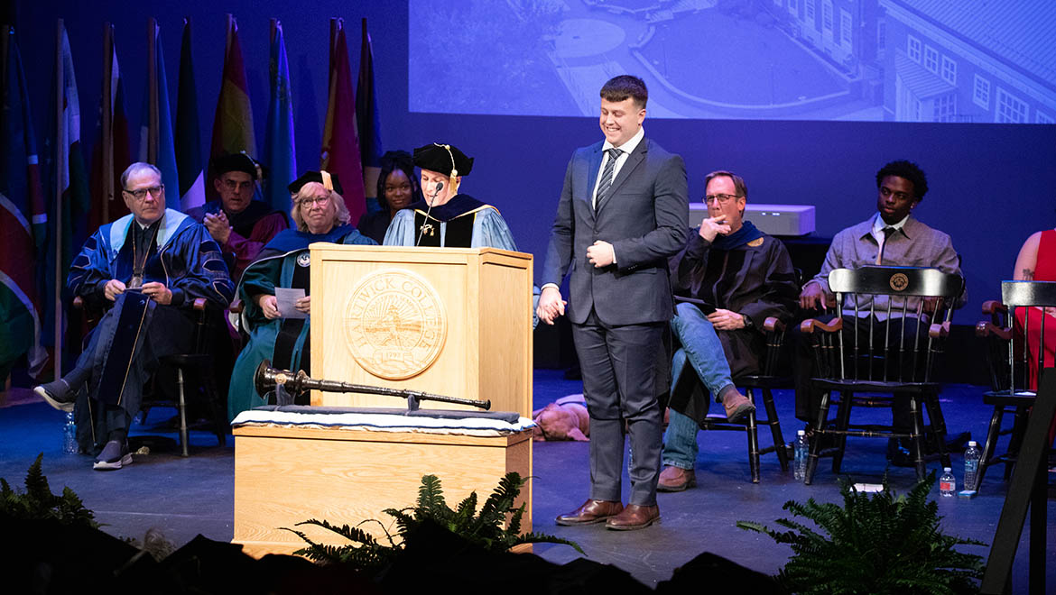 Professor Susan Navarette with past Kellogg prize winner, Michael Demaris '24 introducing the Kellogg speakers at Honors Convocation