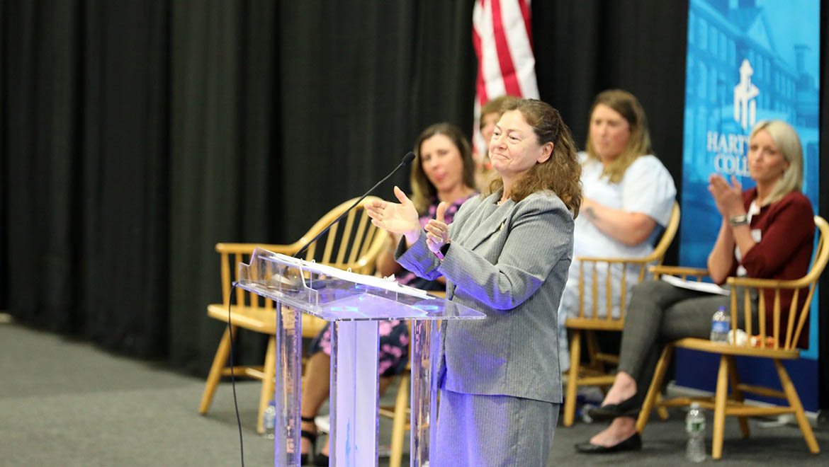 Faculty member Lorena Marra speaking at Class of 2025 Nurses Pinning Ceremony