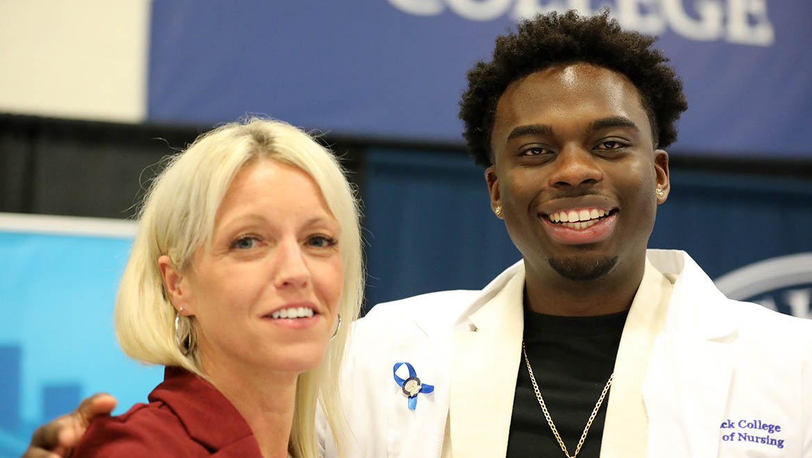 Hartwick College nursing graduate with faculty member after being 