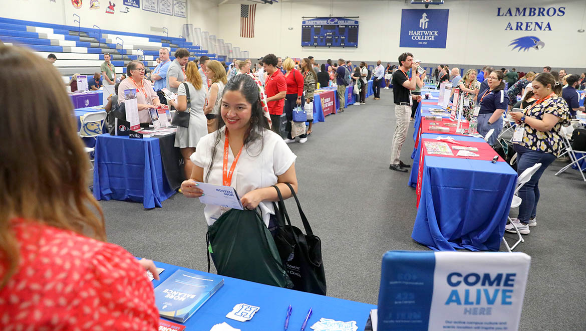 NY State college admission counselors in Hartwick College's Lambros Arena during the NYSACAC Conference