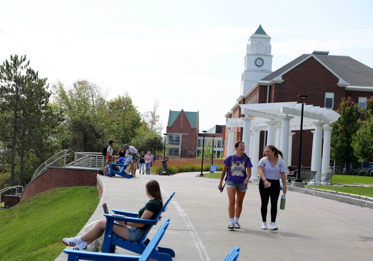 Hartwick College students walking on Founders' Way on campus
