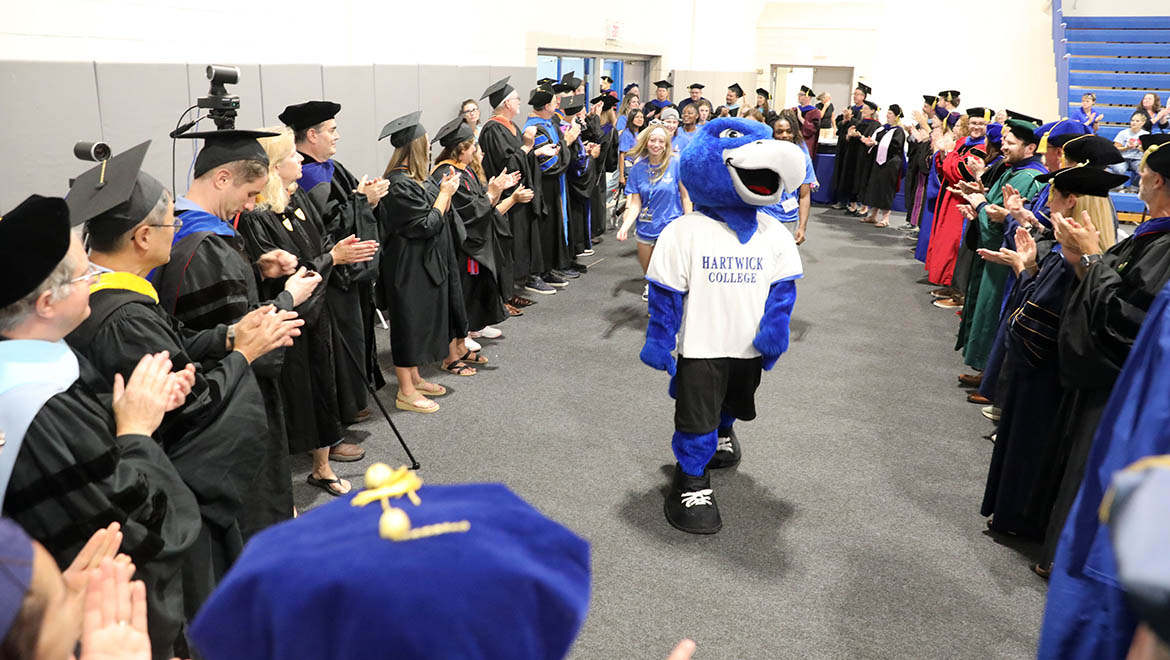 Swoop leading the Class of 2029 into Lambros Arena for Opening Convocation Ceremony