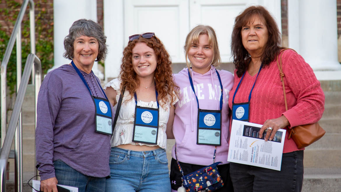 Hartwick College students with family members on Founders' Way