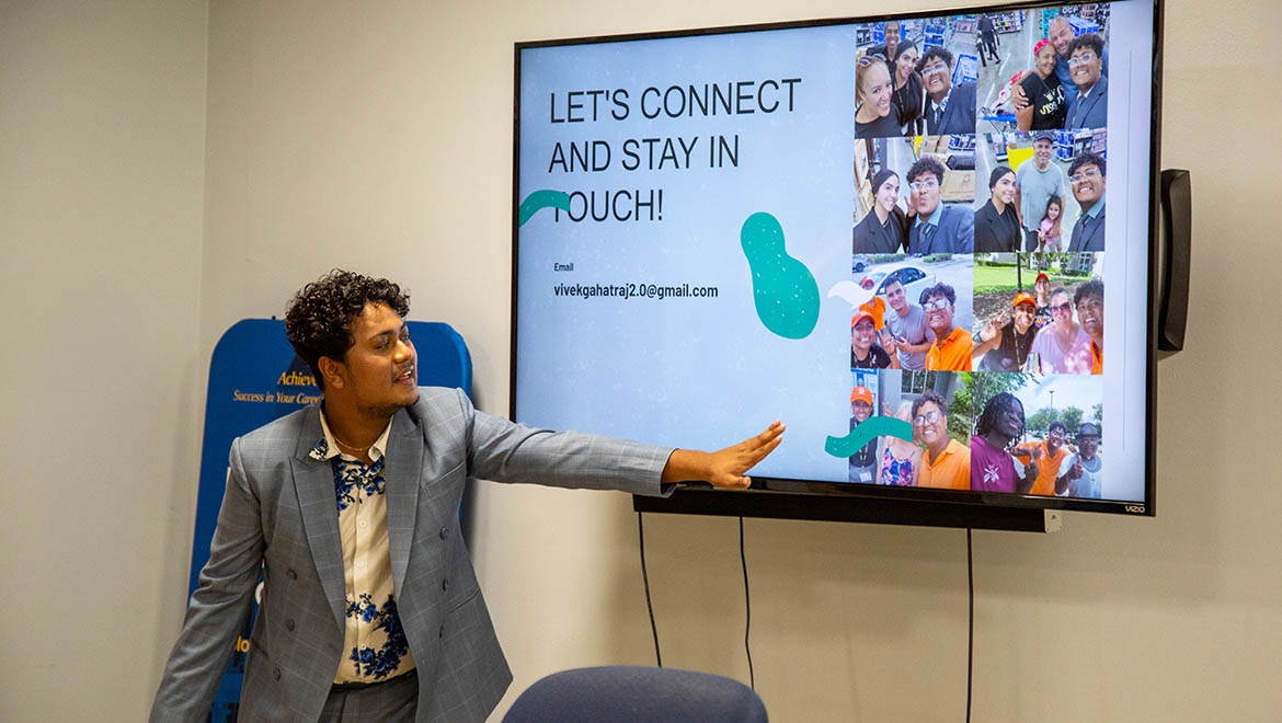 Hartwick College student giving presentation about his summer internship