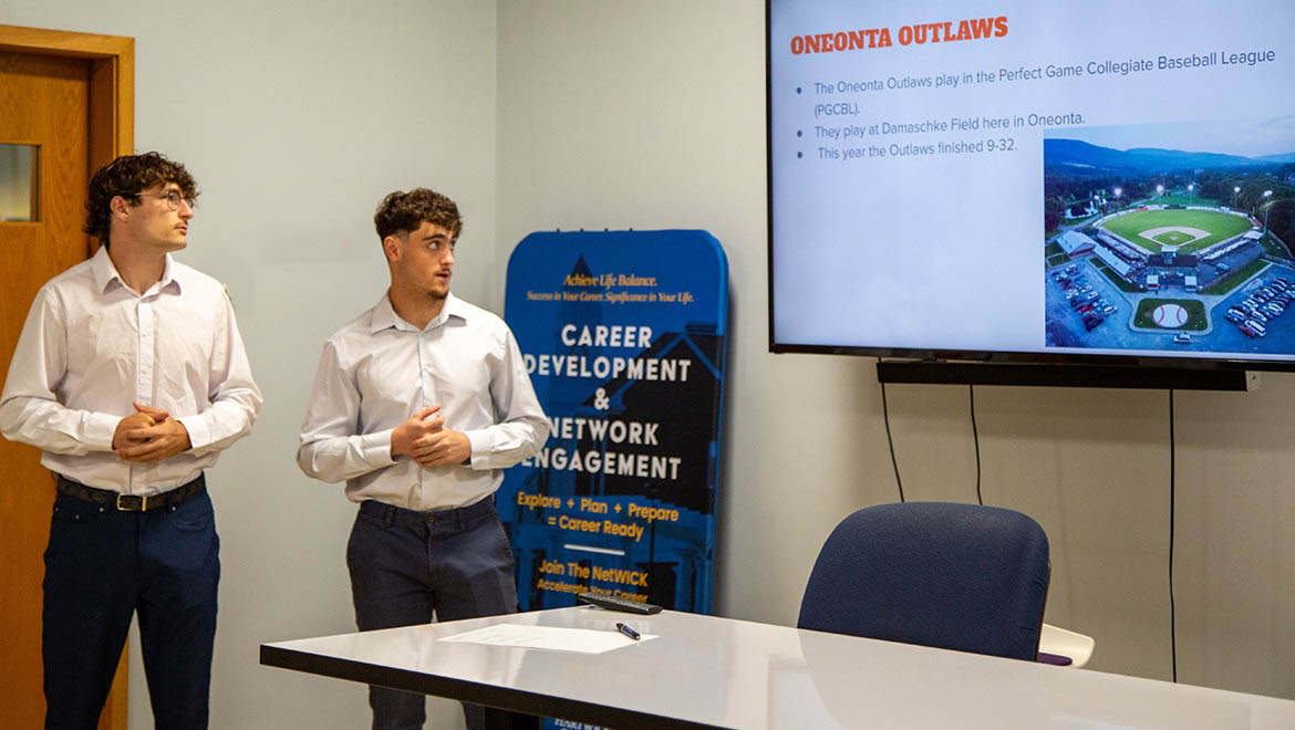 Hartwick College student giving presentation about their summer internship