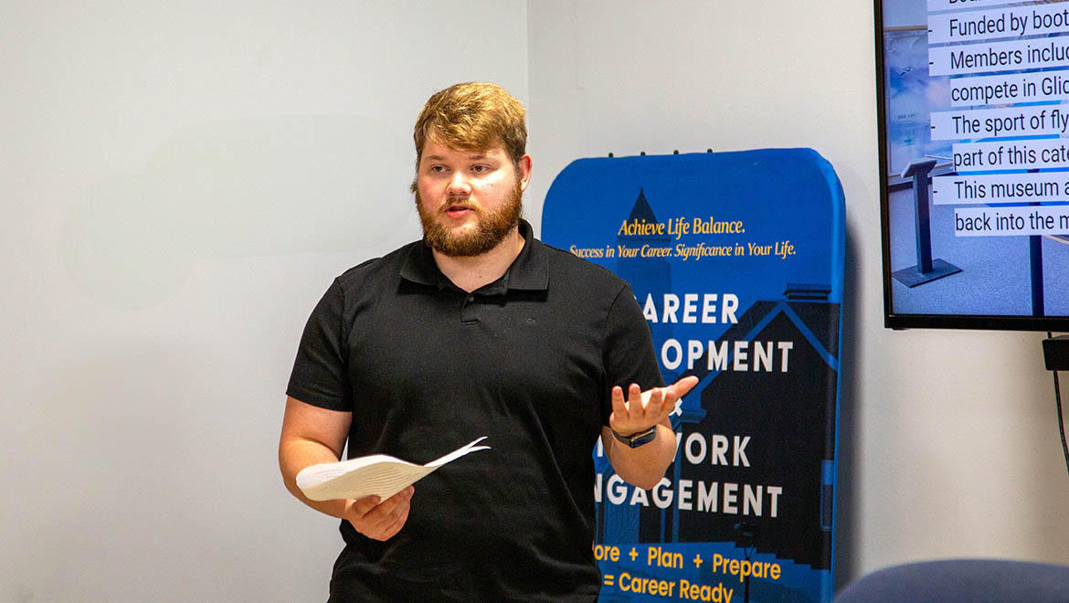 Hartwick College student giving presentation about his summer internship