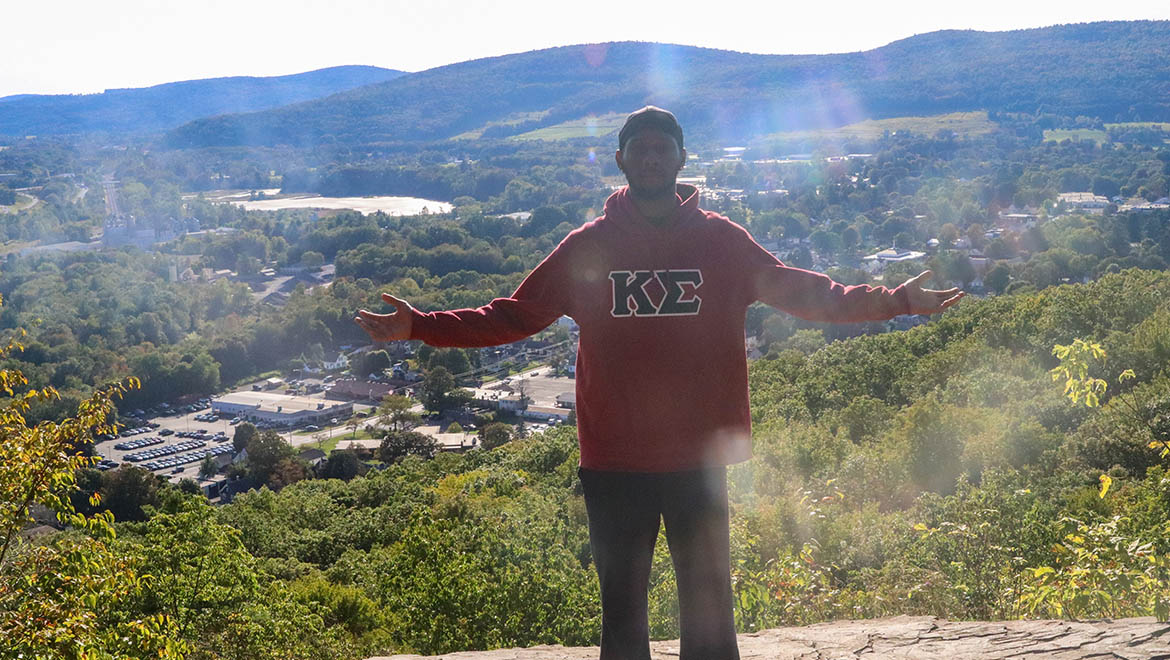 Khadifi Madison '27 at Table Rock Trail Overlook with the City of Oneonta and surrounding hills in the background