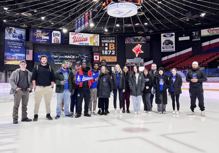 Hartwick College students and staff on center ice during Career Exploration Trip with the Utica Comets