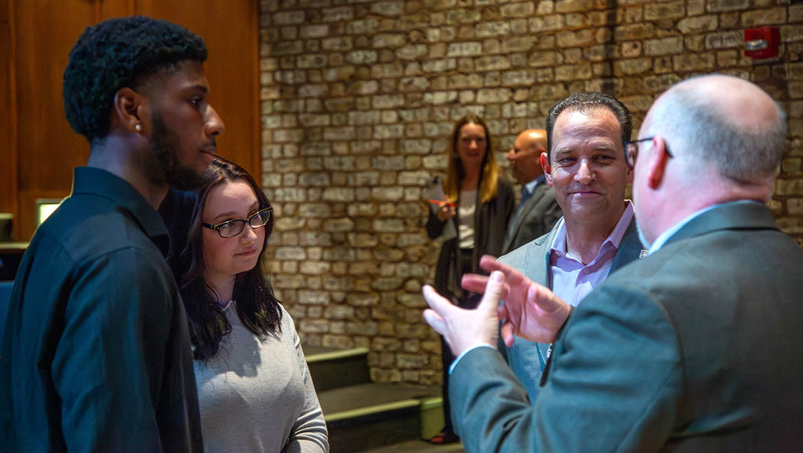 Khadifi Madison ’27 with co-interviewer Noelle Mulik '27 talking with Josh Rawitch and Scott Dalrymple