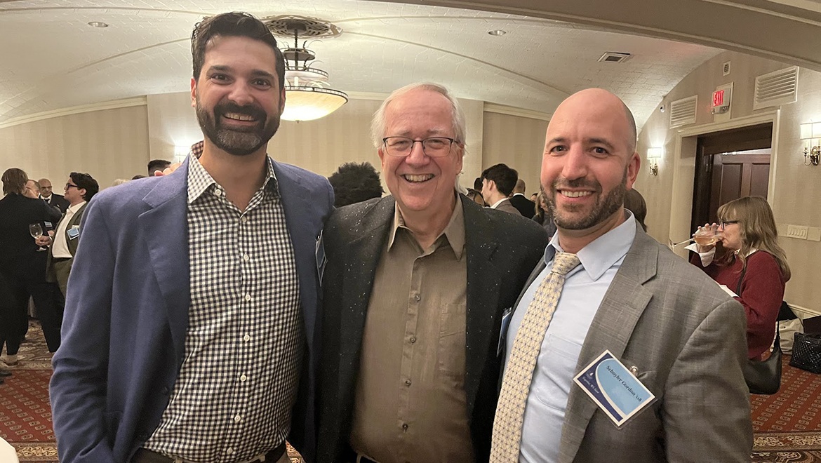 Professor Emeritus Malone with Adam Randall ’10 and Sky Gordon ’08 during Hartwick College Institute of Public Service reception.