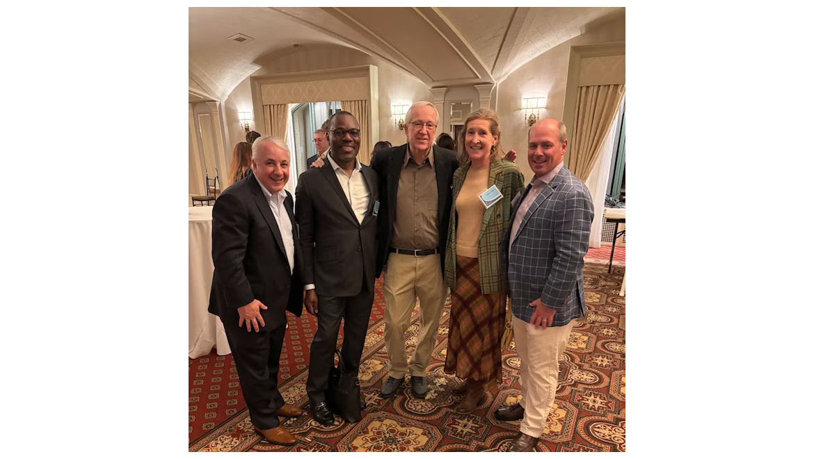 Professor Emeritus Malone with alumni from the Class of 1991 during Hartwick College Institute of Public Service reception.