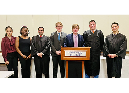 Moot Court finalists Adilyam Imyarova ’27 and Sarah Matumbura ’26, and Champions Cooper Cohen ’28 and John “Jack” Reichel ’26 with Thomas Holmgren ’13, Aaron Carbone ’03 and Carlo A. C. de Oliveira ’02