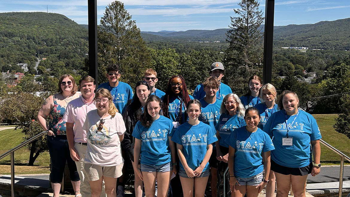 Hartwick College START students on Founders' Way with valley view in background