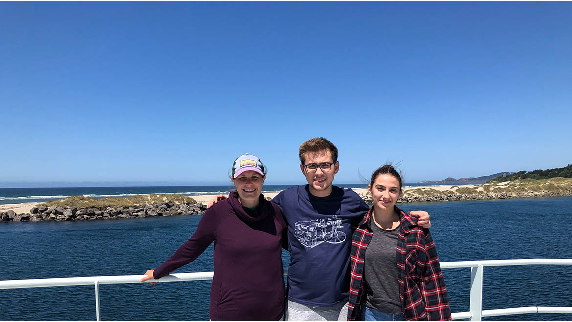 Daisernia, Professor Carr and Sierra Brown '25 on the Research Vessel Thomas G. Thompson leaving Newport, Oregon.