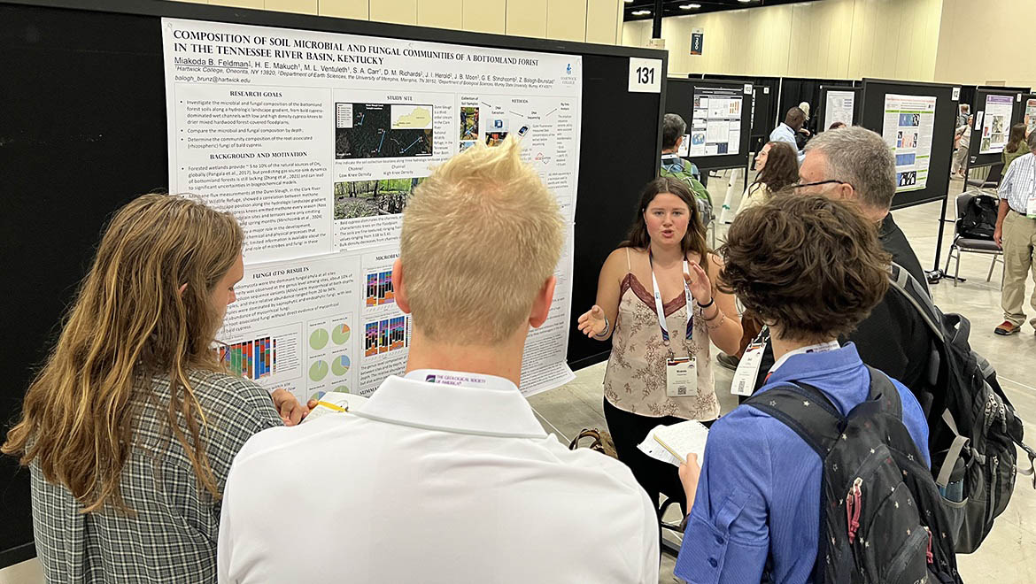 Miakoda Feldman discussing her research during conference