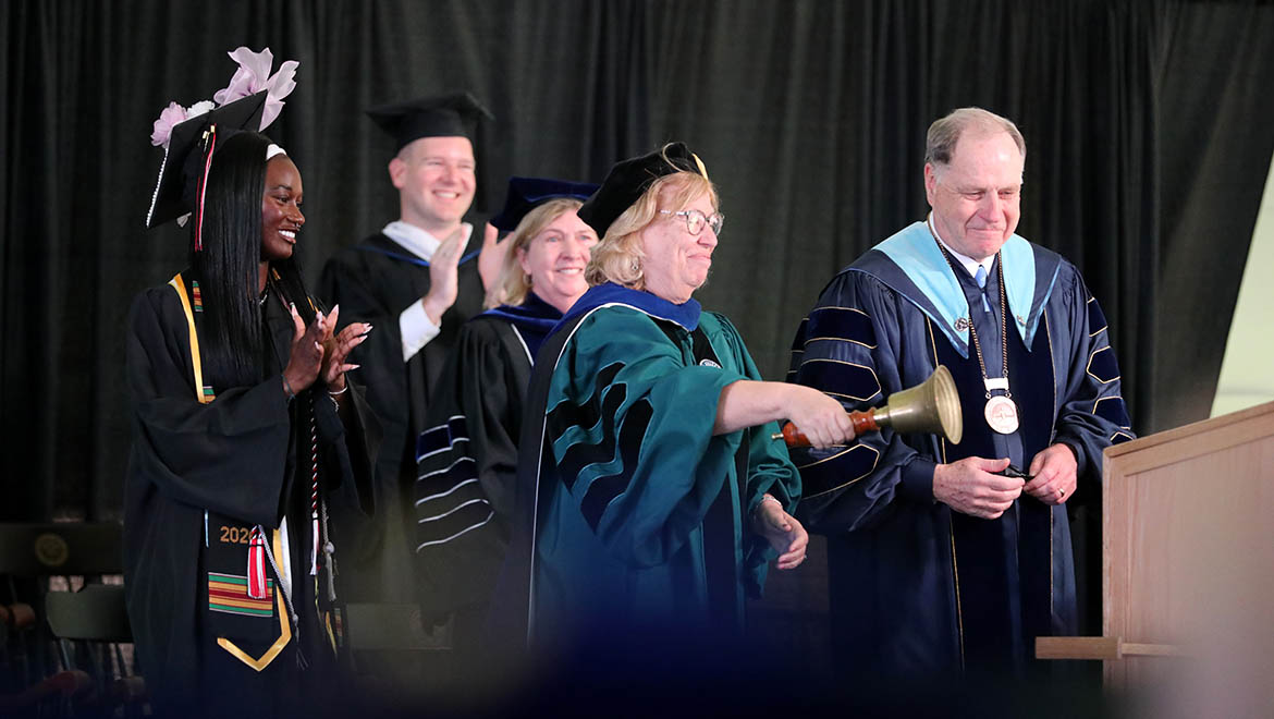 Laurel Bongiorno, president-elect and vice president for academic affairs and provost with President Mullen ring the Commencement bell