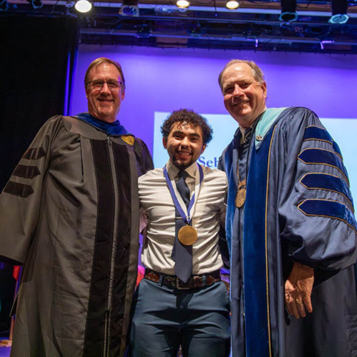 John Christopher Hartwick Scholar Sebastian Quarella with Professor Buthman and President Mullen