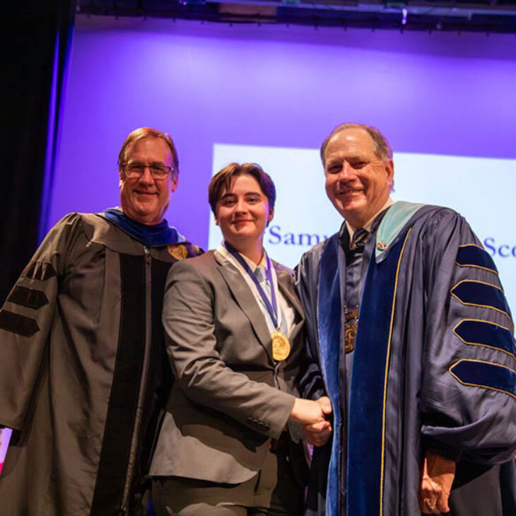 John Christopher Hartwick Scholar Samuel M. Scott with Professor Buthman and President Mullen