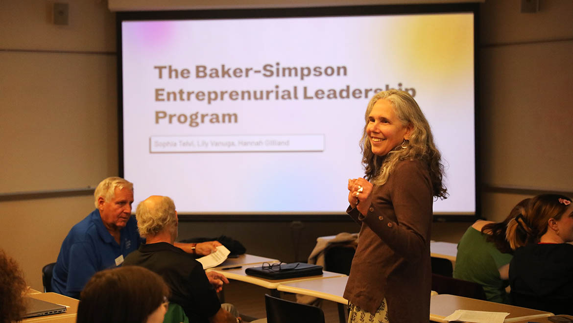 Hartwick Collage faculty member introducing student presenters during Student Showcase