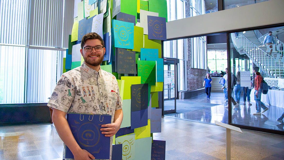 Hartwick student at Senior Art Show during Showcase