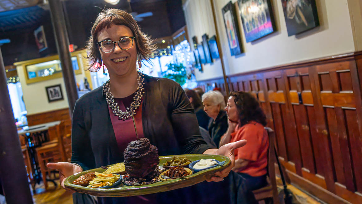 Rozene’s serving dinner on dinnerware created in her course The Dinnerware Project