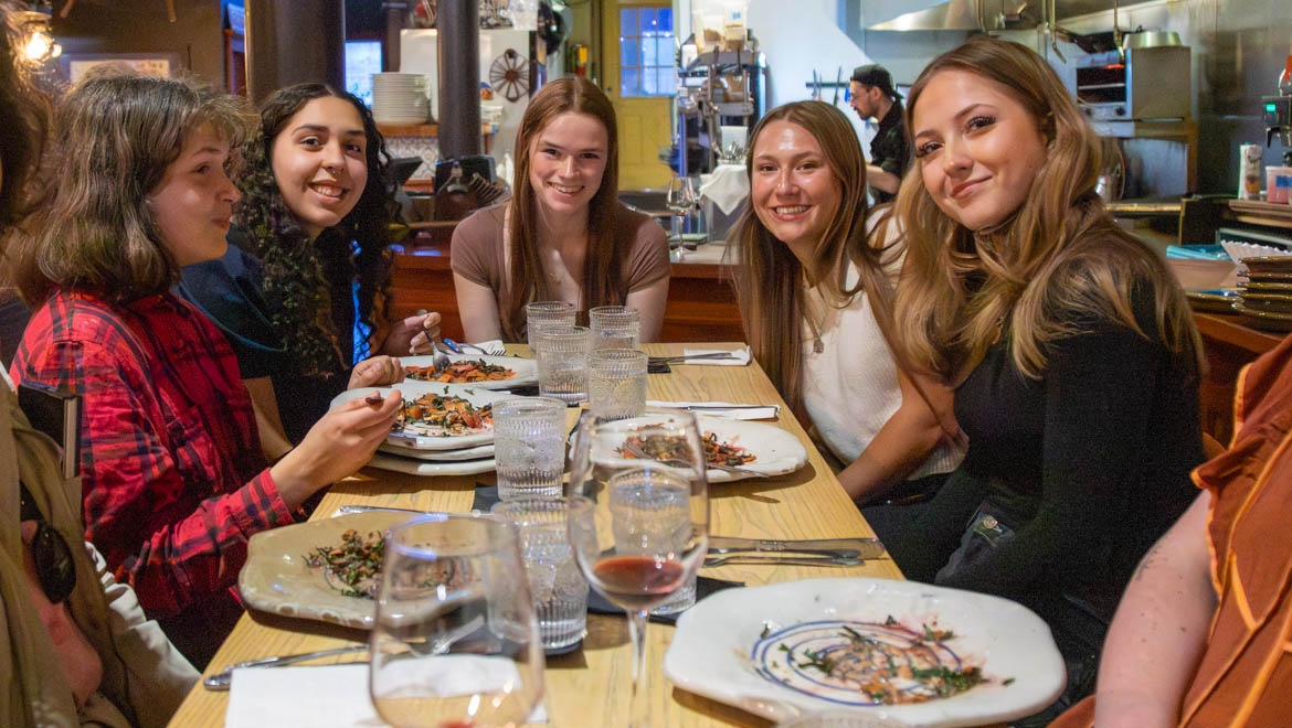 Hartwick students enjoy dinner during The Dinnerware Project event at Oneonta's Autum Cafe