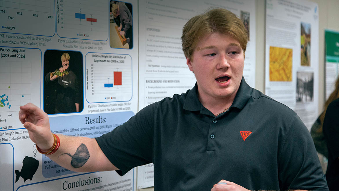 Dylan Olsen '26 presenting his research during Student Showcase